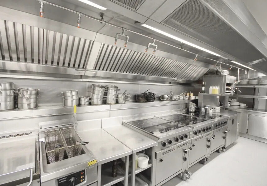 A commercial kitchen with many different types of appliances.